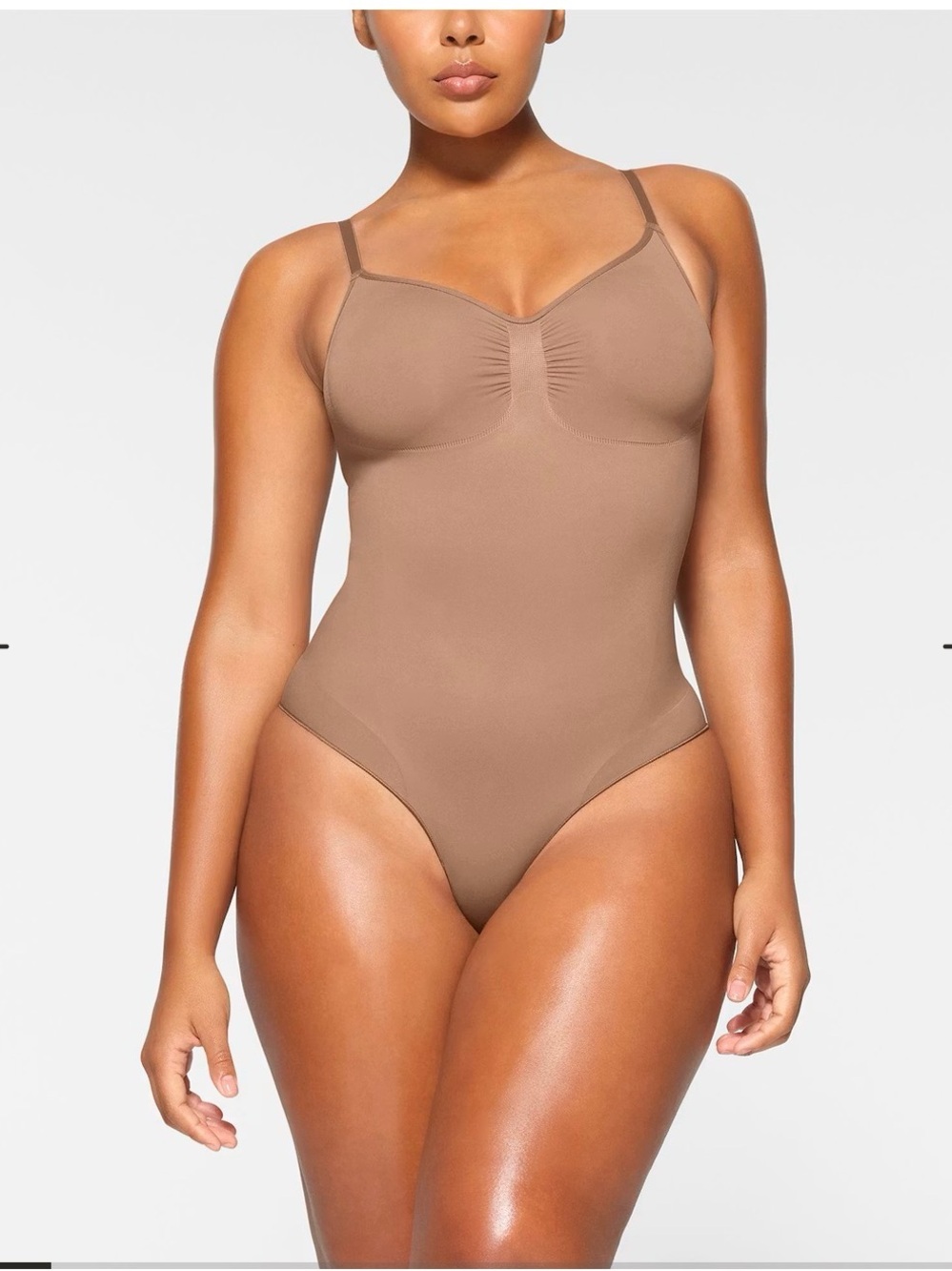 SKIMS Sculpting Thong Bodysuit in Brown